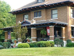 Uniquely American, the Foursquare style home features four main rooms on each floor and often features either a Prarie box or Arts and Crafts style architectural design.