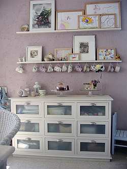 An alternative to hanging art is to use a display shelf.