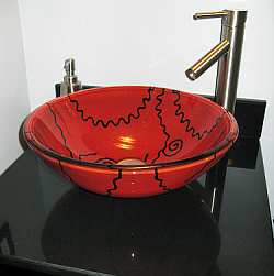 An art glass vessel sink give this bathroom design a completely unique and stylish look.