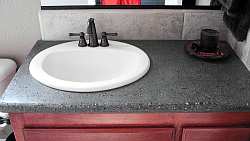 Granite is always a standby choice in bathroom countertop materials: hard, smooth and durable.