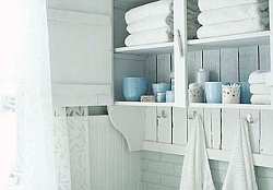 Hooks attached to the wall or under shelving will make a great way to hang bath towels.