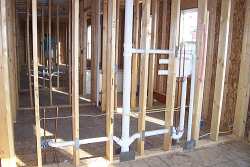 Most of the rough plumbing and electrical is done after framing, while the walls are open.