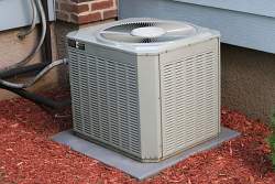 The outdoor or hot side of a central air conditioning system consists of the compressor and condenser coil.