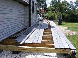 Depending on the shape and configuration of your deck, it may be easiest to start from the outside and work your way toward the house; take time to plan your layout before fastening the decking.
