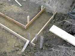 Boards form the shape for foundation footings, which are typically about 2 feet wide.