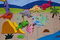 Look for wall stickers or felt dinosaurs like these if you prefer not to paint a mural on your dinosaur bedroom wall.