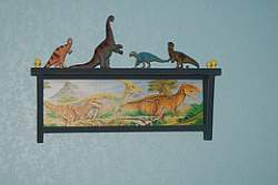 A dinosaur display shelf is the perfect way to let your son show off his collection!