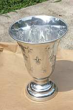 Take an ordinary object such as this metallic urn and transform it into something unique and special.
