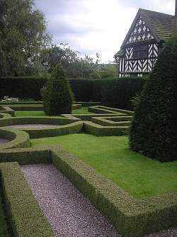 Topiaries and hedges trimmed to form square or circular shapes are the hallmark of a good formal garden design.