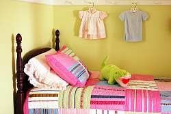 Yellow and pink create great contrast in this cute girls room decor.