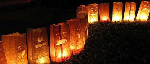 Its easy to make your own inexpensive Halloween illuminaries to light your porch, driveway or walkway using plain old brown paper bags.