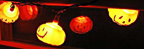 Look for speciality Halloween lights such as these pumpkin lights, ghosts, skeletons or other designs you can put in a window or hang outdoors to give your house a spooky Halloween look.