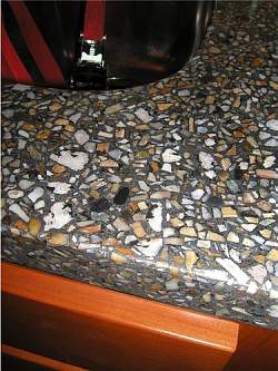 Concrete kitchen countertops can have very unique finishes such as this imitation Terrazzo countertop.