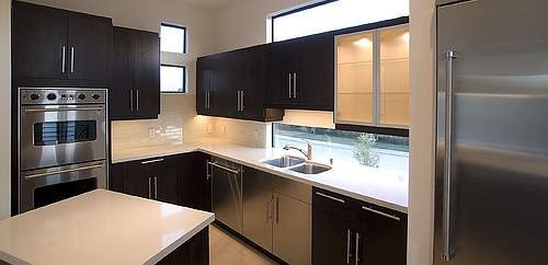 Engineered countertop materials such as Silestone can give your kitchen the look of real stone but with certain advantages.