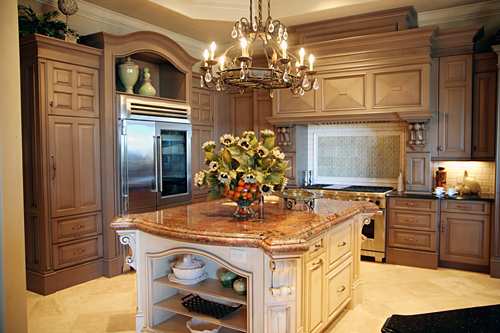 The trend in kitchen cabinetry is toward enhanced attention to detail, hardwood materials and quality craftsmanship. Here, the center island is a distinctive piece of furniture, rather than simply another cabinet.