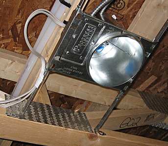 Standard pre-finish recessed lighting fixture brackets, installed prior to drywall. Finish hardware goes in after drywall and paint.