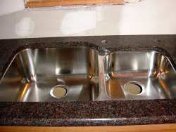 Finishing steps such as installing your new kitchen sink are a sure sign that your kitchen remodeling project is nearing completion!