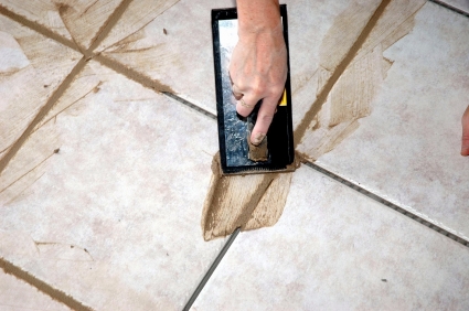 Learn to install your own ceramic floor tiles. Grouting is the final step.