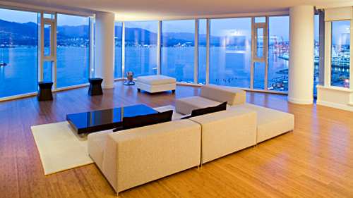 The living room in this luxury apartment is left spare, giving it a clean, sleek modern look that takes full advantage of the amazing view.