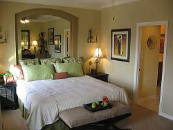 Warm tones and more neutral wall colors are desirable in many master bedrooms.