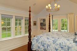 A nautical or ocean theme can be understated as this classic bedroom design shows.