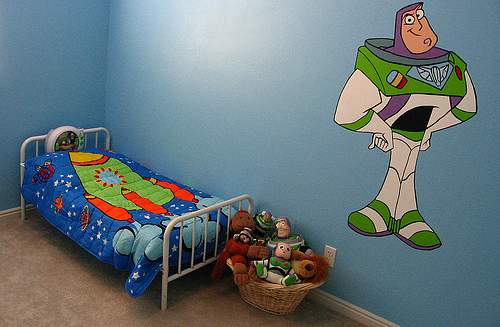 An outerspace theme such as Buzz Lightyear can easily be achieved with wall decorating, bedding and a few toys and accessories.