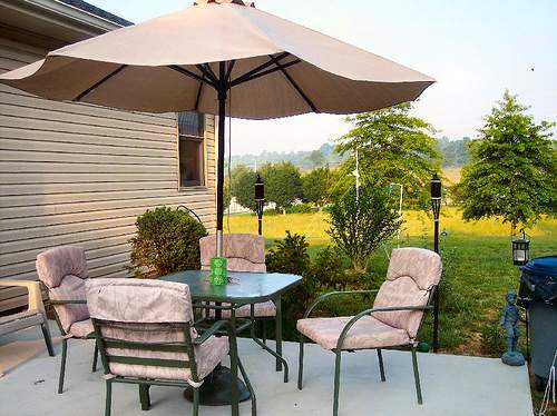 Affordable and simple, a patio umbrella offers shade on your patio without the expense and maintenance of more elaborate patio covers.