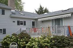 A retractable awning offers shade while being easily stored away when not in use.