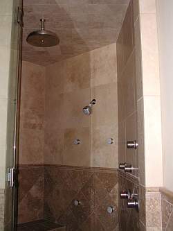 Transform your shower into a Tuscan Steam Shower, complete with travertine marble, rain head and body sprays for the ultimate shower experience!