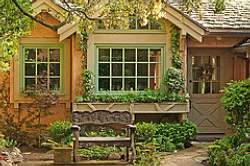 Remember to plan comfortable seating in your yard; here a bench provides a quiet place to sit and relax outdoors!