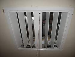 Louvers open and close to seal up the attic space when the whole house fan is not in use.