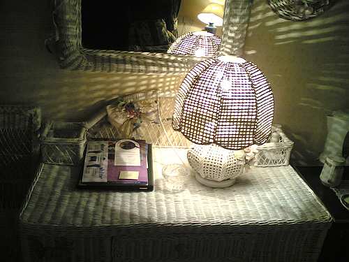 Wicker can be used for more than just furniture, as this fabulous room decor shows; with a chest, wall mirror, lampshade and other accessories all made from wicker.